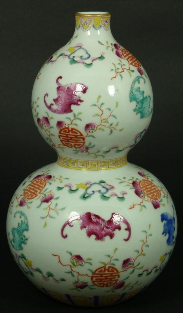 18th C CHINESE PORCELAIN DOUBLE GOURD VASE: Antique Chinese Qing Dynasty period hand painted porcelain double gourd hulu form vase. Depicts enameled bats, symbols, peaches and flowers. Bottom holds blue six character calligraphy Qianlong (1736-