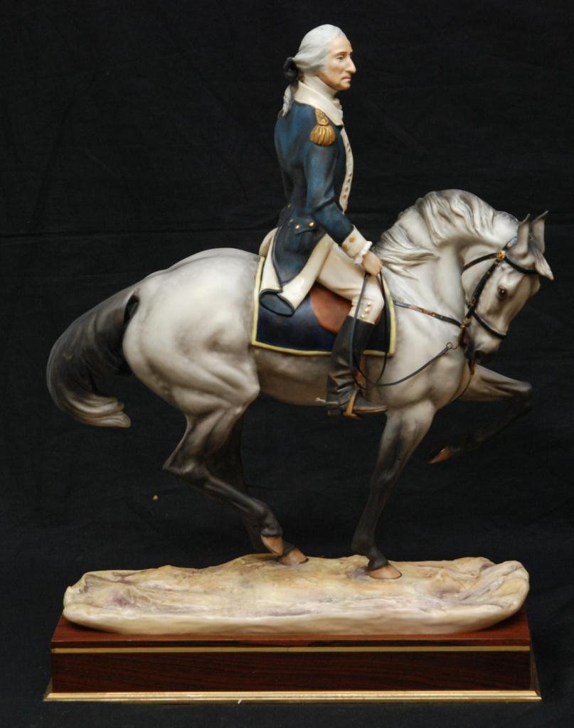 ROYAL WORCESTER 'WASHINGTON' PORCELAIN FIGURE: Royal Worcester English porcelain figure depicting President George Washington on horseback. Includes fitted wooden base with name plaque. Dated 1975 on bottom. Marked number 96 on bottom. Modeled by 