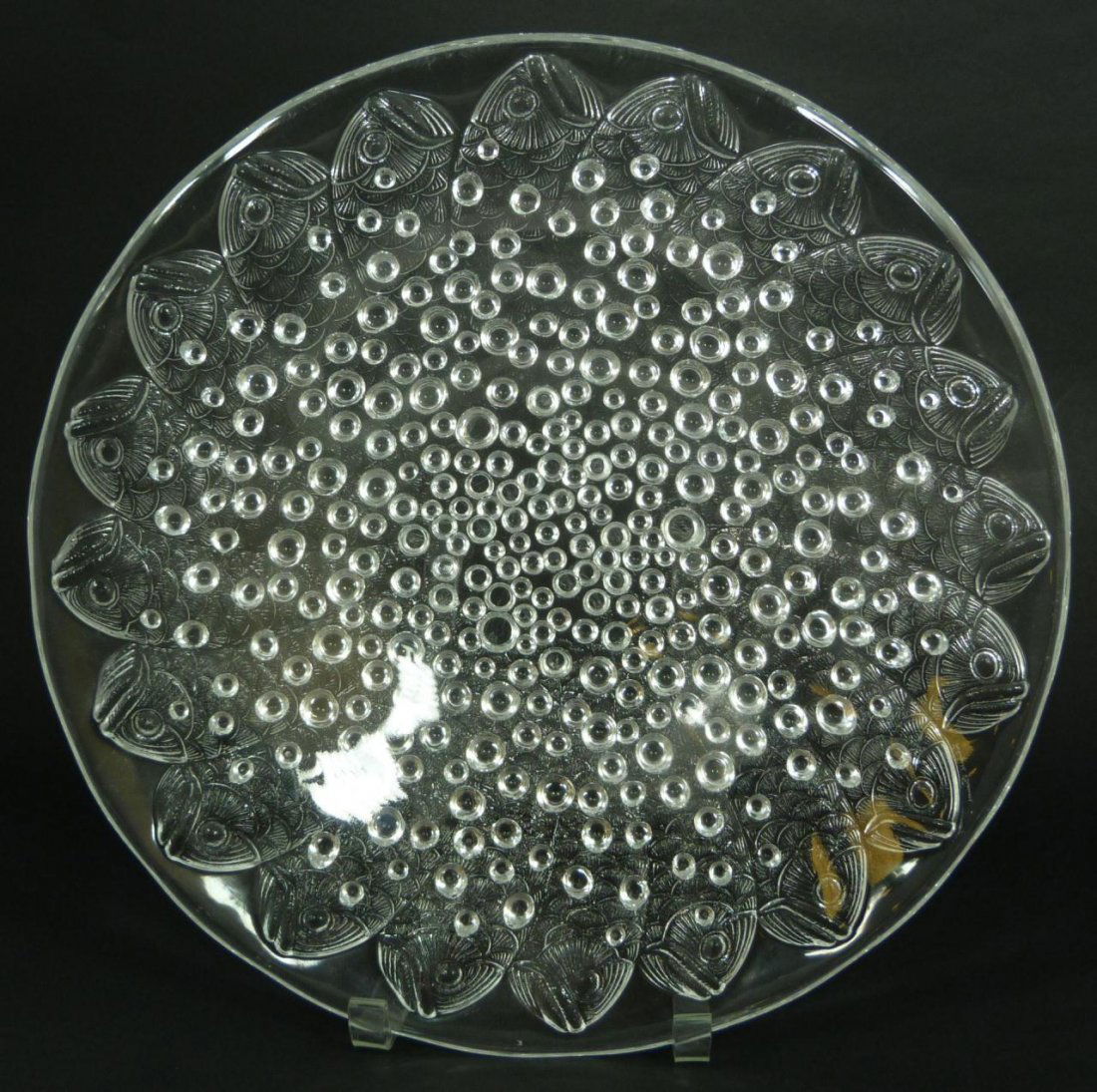 LALIQUE FRANCE CRYSTAL 'ROSCOFF' CENTERPIECE BOWL: A Lalique French crystal 'Roscoff' centerpiece bowl depicting numerous fish with beaded design. Holds etched Lalique France marks on underside of rim. Measures 2 1/2" height x 14" diameter (6.3cm x 35