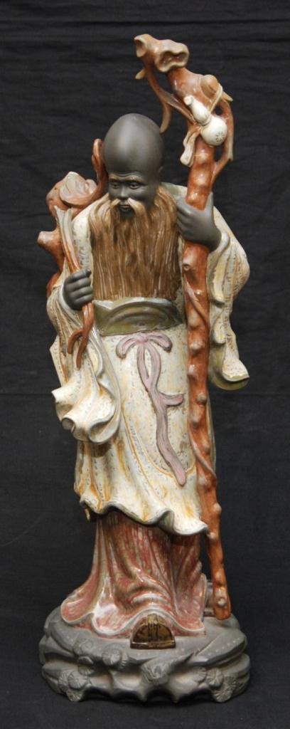 LLADRO PORCELAIN GRES 'CHINESE FARMER WITH STAFF': Lladro Spanish porcelain gres figure titled 'Chinese Farmer with Staff' or 'Chino Agricultor Baston'. Number 2065. Sculpted by Jose Roig. Issued in 1977 and retired in 1985. Measures approx. 19 3/4" h
