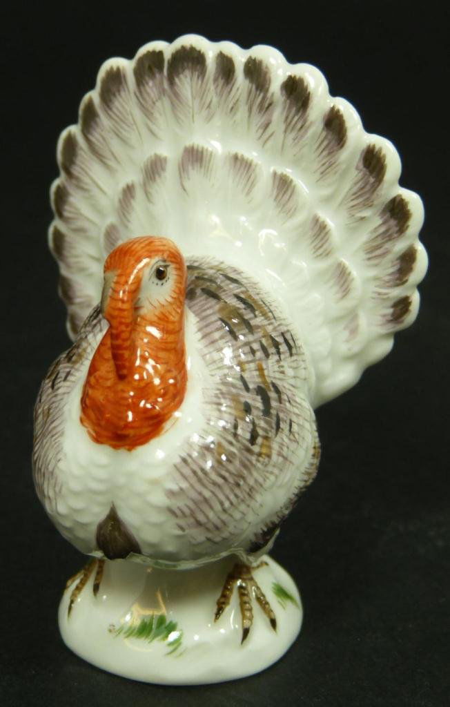 19TH C. MEISSEN GERMAN PORCELAIN TURKEY FIGURINE: Antique Meissen German porcelain turkey figurine. Bottom has blue underglaze crossed swords mark and is also marked 779 11. 19th Century. Measures 2 5/8 inch height (6.7 cm) x 2 inch width (5.1 cm). T