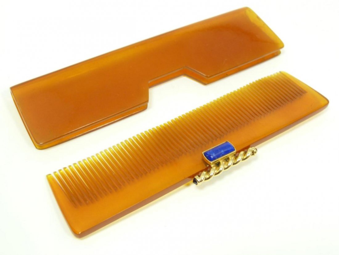 CARTIER 18KT YG & TORTOISE SHELL COMB W/ COVER: Cartier hair comb with round cabochon sapphire jewels and rectangular cut lapis lazuli stones mounted to 18 karat yellow gold handle. Includes tortoise shell case. Also includes original Cartier prese