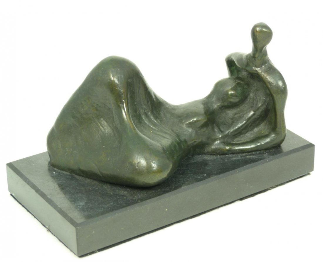 ABSTRACT BRONZE SCULPTURE HENRY MOORE: Abstract bronze figure depicting a recumbent figure. Mounted on a black marble plinth. Signed 'Moore' on verso. After Henry Moore (BRITISH, 1896-1986). Measures 2 3/4 inch height (7 cm) x 5 inch lengt