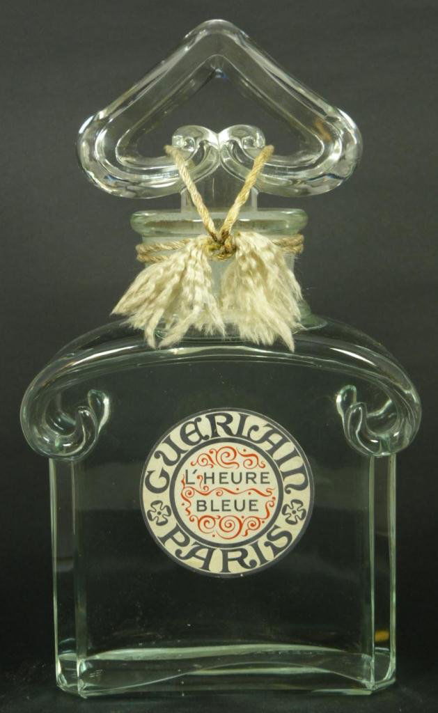 GUERLAIN 'L'HEURE BLEUE' FACTICE PERFUME BOTTLE: Guerlain 'L'Heure Bleue' French crystal factice perfume bottle. Bottom marked 'Guerlain Paris H.P.' Measures 12 inch height (30.5 cm) x 7 inch width (17.8 cm) x 3 1/2 inch depth (8.9 cm). Total weight