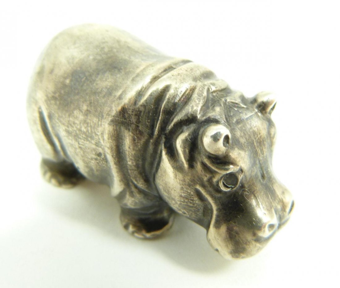 RUSSIAN SILVER HIPPOPOTAMUS FIGURE: Russian silver standing hippopotamus figure with cabochon cut pink sapphire jewels set in eyes. Has town marks and 84 silver purity marks to side of leg. Also holds Cyrillic workmaster mark. Measures 