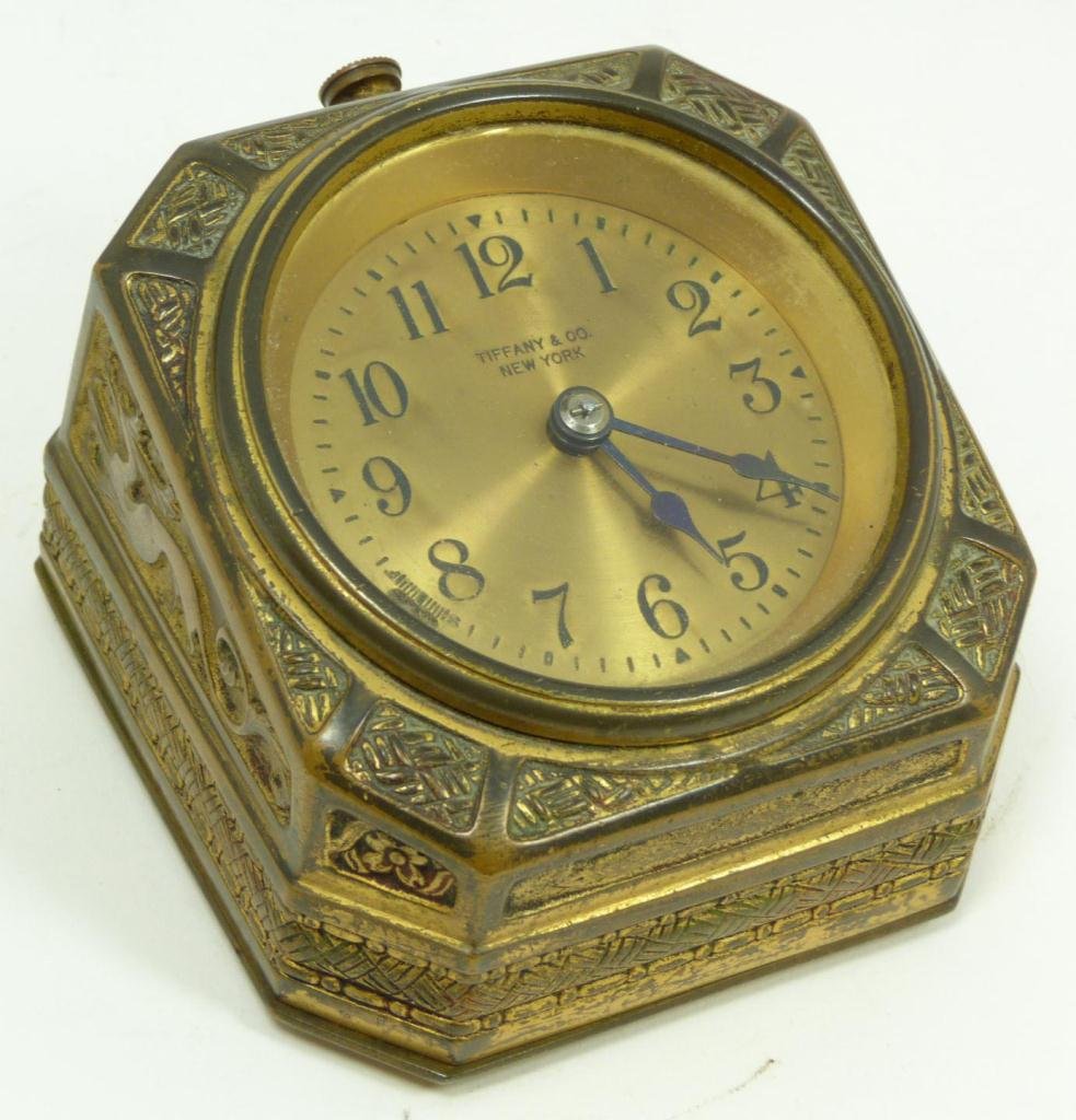 TIFFANY STUDIOS SPANISH BRONZE DESK CLOCK: Old Tiffany Studios "Spanish" bronze desk clock. Has gold tone face with black enamel numerals and notches. Tiffany & Co., New York to face. Black hour and minute hands. Impressed TIFFANY STUDIOS NEW 