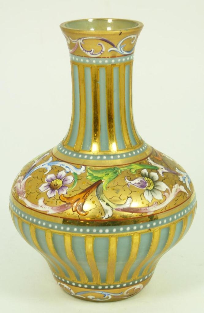 EUROPEAN HAND PAINTED OPALINE GLASS CAMEO VASE: Antique European hand painted opaline art glass cameo vase with hand painted enameled floral scrolled design over gold gilt ground. 19th century. Measures 6 1/2" height x 4 3/4" diameter (16.5cm x 12c