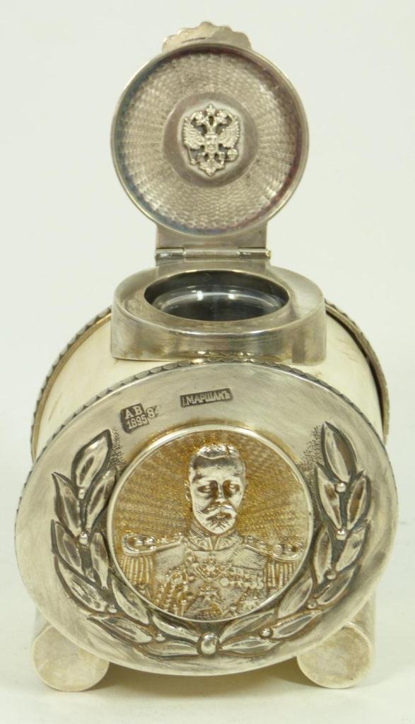 RUSSIAN GUILLOCHE SILVER & IVORY INKWELL: Russian guilloche enamel and silver inkwell with carved ivory tusk section as body. Silver end caps hold applique silver coin depicting Nicholas II encased in wreath. Top of hinged silver inkwell has 