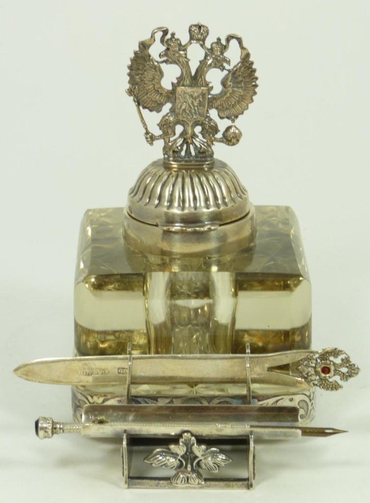 RUSSIAN SILVER & CRYSTAL EAGLE INKWELL SET: Russian silver and cut crystal inkwell with a figural double headed eagle finial on cover. Also has scrolled vine silver frame with holder for letter opener and pen. Each piece marked with 84 Zolotnik