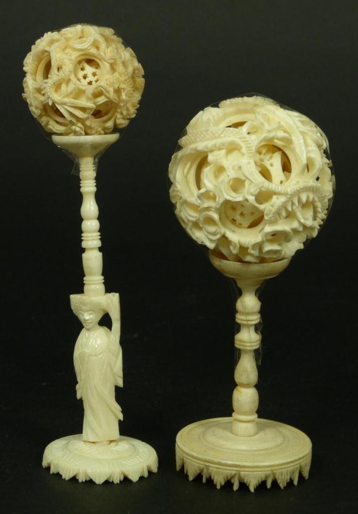 PAIR OF CHINESE CARVED IVORY CONCENTRIC BALLS: A pair of Chinese fully reticulated ivory concentric balls. 19th/20th century. Tallest measures 5 3/4" height (14.6cm). Total ivory weight of 88 grams.