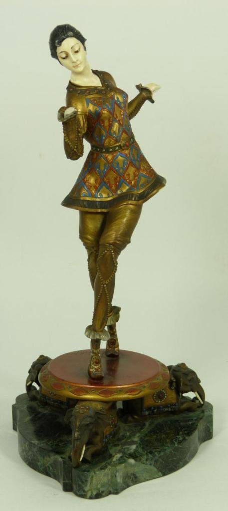 HANS KECK COLD PAINTED BRONZE & IVORY FIGURE: Hans Keck (GERMAN, active circa 1920-1922) cold painted bronze and ivory figure depicting a dancing woman standing on round plinth with three figural seated elephant feet with ivory tusks. Mounted on