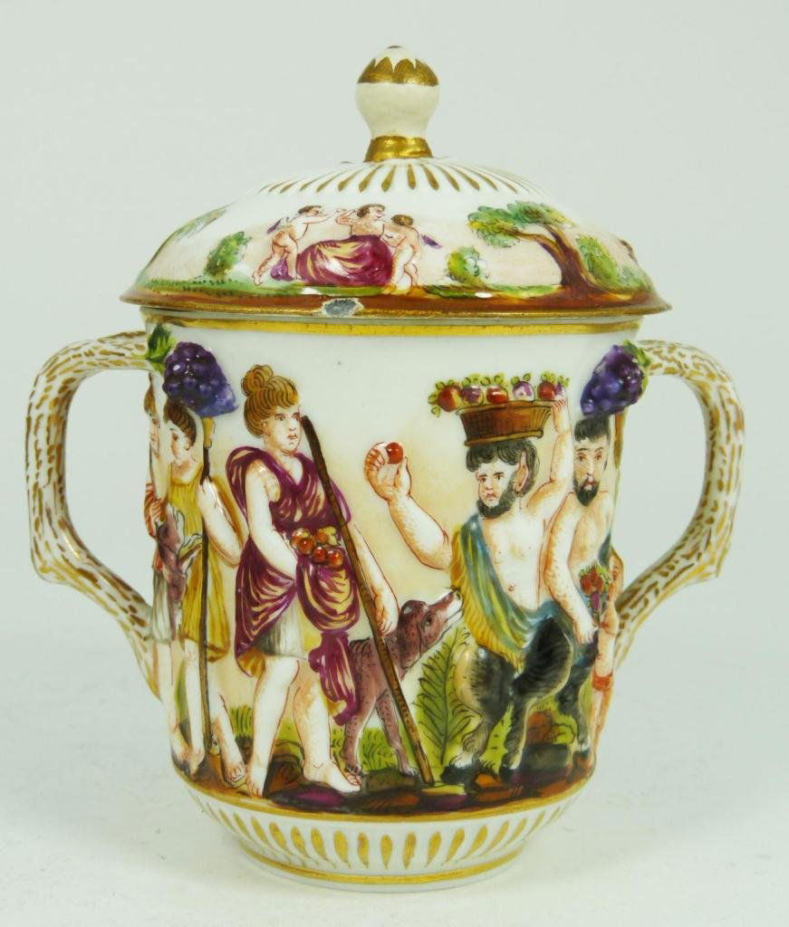 CAPODIMONTE PORCELAIN LIDDED CUP W/ BRANCH HANDLE: An antique Capodimonte porcelain lidded cup having figural branch handles. Holds blue Crown over N marks to bottom. 19th century. Measures 4 1/4" height (10.7cm). Total weight of 212 grams.