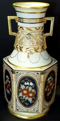 19TH C NIPPON HAND PAINTED 2 HANDLED URN VASE: Very nice antique Nippon Hand Painted two handled vase. Has a Hand painted floral and gilded design. Has gilt beading to borders. 19th century. Measures 13 3/4" height (34.9cm).