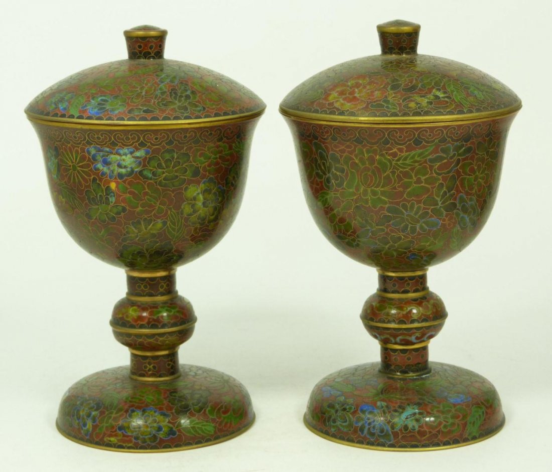 Pr. CHINESE CLOISONNE COVERED CUPS: Pair of Chinese cloisonne covered goblets with multicolored floral design throughout over rust red ground. Have turquoise interior and bottom. 19th/20th Century. Each approx. 7 1/8 inch height (18.1 c