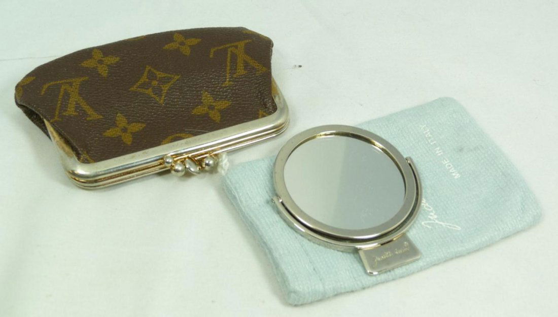 LOUIS VUITTON CHANGE PURSE & JUDITH LEIBER MIRROR: A Louis Vuitton leather monogram change purse and Judith Leiber silver tone hand mirror with original dust cover bag. Largest pieces 4 7/8" length (12.3cm). Total weight of 106 grams.