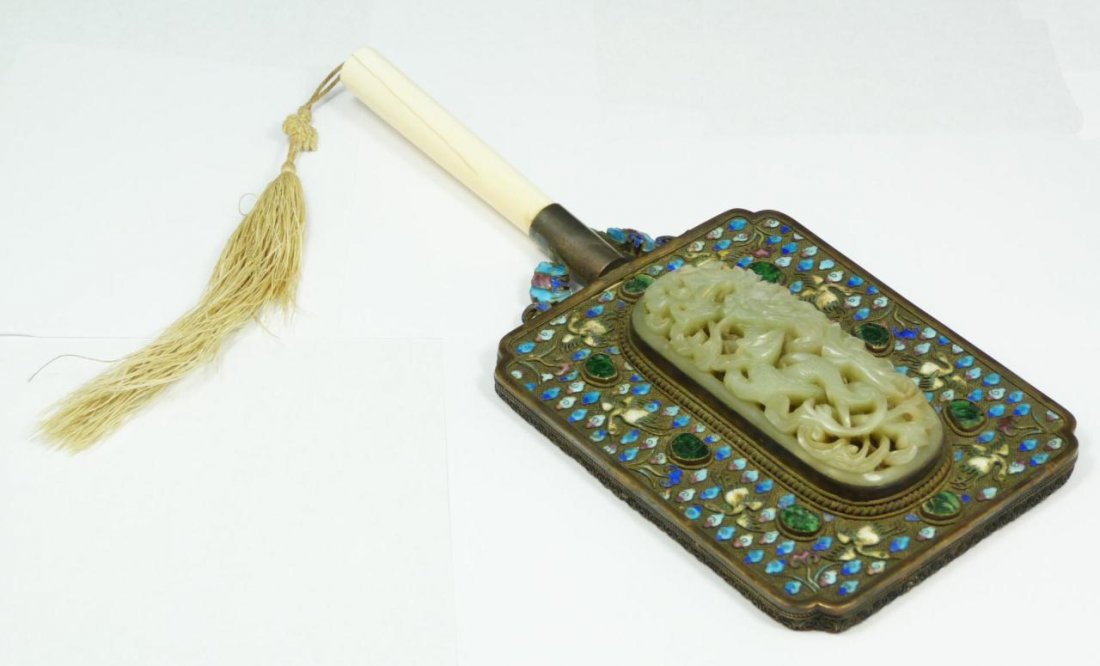 CHINESE CLOISONNE & JADE MIRROR w IVORY HANDLE: A Chinese cloisonne enameled mirror depicting cranes amongst clouds. 8 emerald green jadeite stones are mounted in between the cranes and clouds. A large rectangular reticulated translucent celadon ja