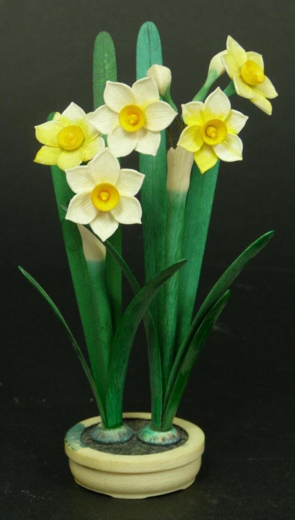 CHINESE CARVED IVORY POLYCHROMED FLOWER GROUP: A Chinese carved and polychromed ivory flower group in pot. Measures 5 1/4" height (13.3cm). Total weight of 45 grams.