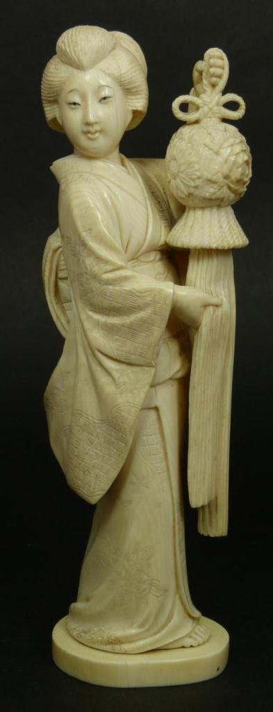 JAPANESE CARVED IVORY FIGUE OF MAIDEN WITH LANTERN: Antique Japanese hand carved ivory figure depicting a standing maiden carrying lantern. Finley carved throughout black enameled eyes. Signed with pinecone mark to bottom. Edo to Meiji Period. Measures