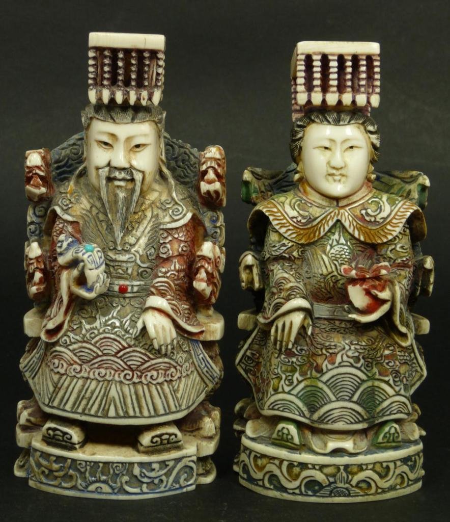 PR PF CHINESE POLTCHROMED OVORY EMPEROR & EMPERESS: Pair of Chinese hand carved and polychromed ivory sculptures depicting emperor and empress seated on thrones. Each having intricate high relief phoenix and dragon robes and relief carved thrones. Each