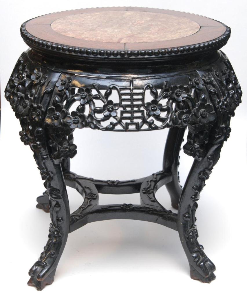 CHINESE CARVED TEAK & MARBLE INLAY STAND TABLE: A Chinese carved teakwood stand side table having round marble inlay to top. Measures approx. 19 1/4" height x 20" diameter (48.8cm x 50.8cm).