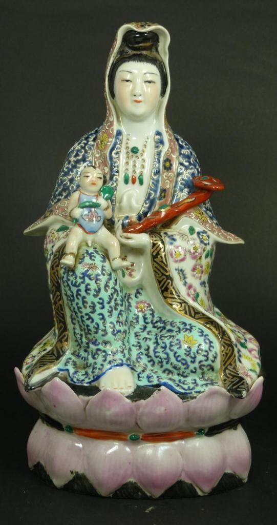 CHINESE REPUBLIC PORCELAIN QUAN YIN FIGURE: Chinese hand painted enameled porcelain Guan Yin figure. She is with child and holding ruyi scepter to left hand. Intricate hand painted floral designs and scrolled vines to layered robe. Se is seated