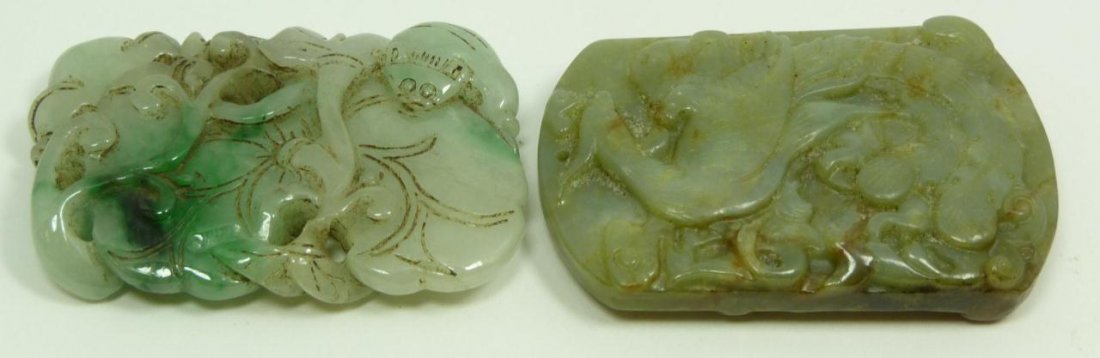 TWO CHINESE CARVED JADE & JADEITE PENDANTS: One Chinese light - apple green Jadeite pendant, carved with ruyi vines, bats, and squash motif. Great translucence, measures 2 3/8" (6.01cm). One Chinese light green Jade pendant with patches of russ