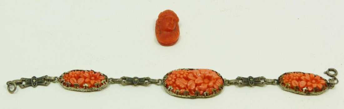 ANTIIQUE STERLING SILVER AND CORAL BRACELET: Antique continental silver bracelet set with marcasite and Chinese raised carved oval floral red coral plaques. Lot also includes a carved red coral cameo; 19th century. Measures 7.5in Length. Total w