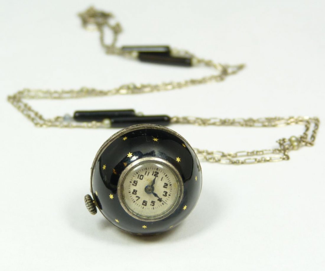 AUSTRIAN EXPORT SWISS 935 STERLING BALL WATCH: Antique Austrian export 935 sterling silver black enameled ball watch necklace. Black enameled design with gold stars to case. Chain necklace with pearls and onyx bar beads. Side of watch mounted with
