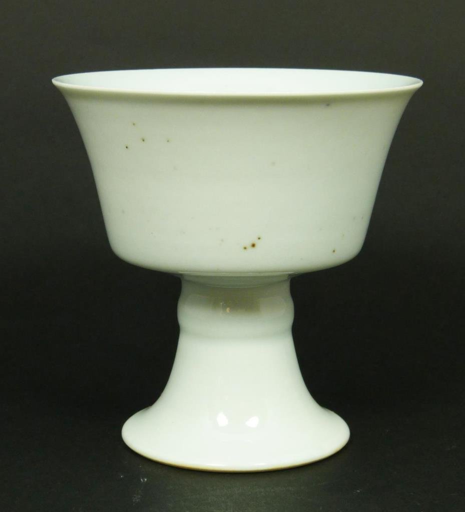 18th C. CHINESE PORCELAIN STEM CUP: Antique Chinese Qing Dynasty Period white glazed porcelain stem cup. Bottom holds six character archaic Qianlong (1736-1795) reign mark, but possibly made as late as 19th century. Measures 2 3/4" Heig