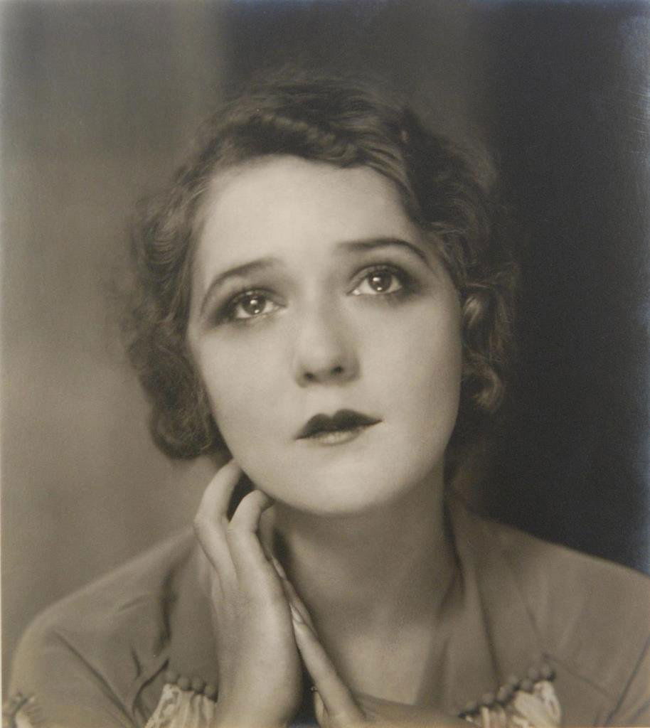 EDWARD STEICHEN PHOTOGRAPH OF MARY PICKFORD: A photography by Edward Steichen depicting Mary Pickford with sad expression. Attached to matting. Image measures 7 1/2" height x 6 3/4" width (19cm x 17.1cm).