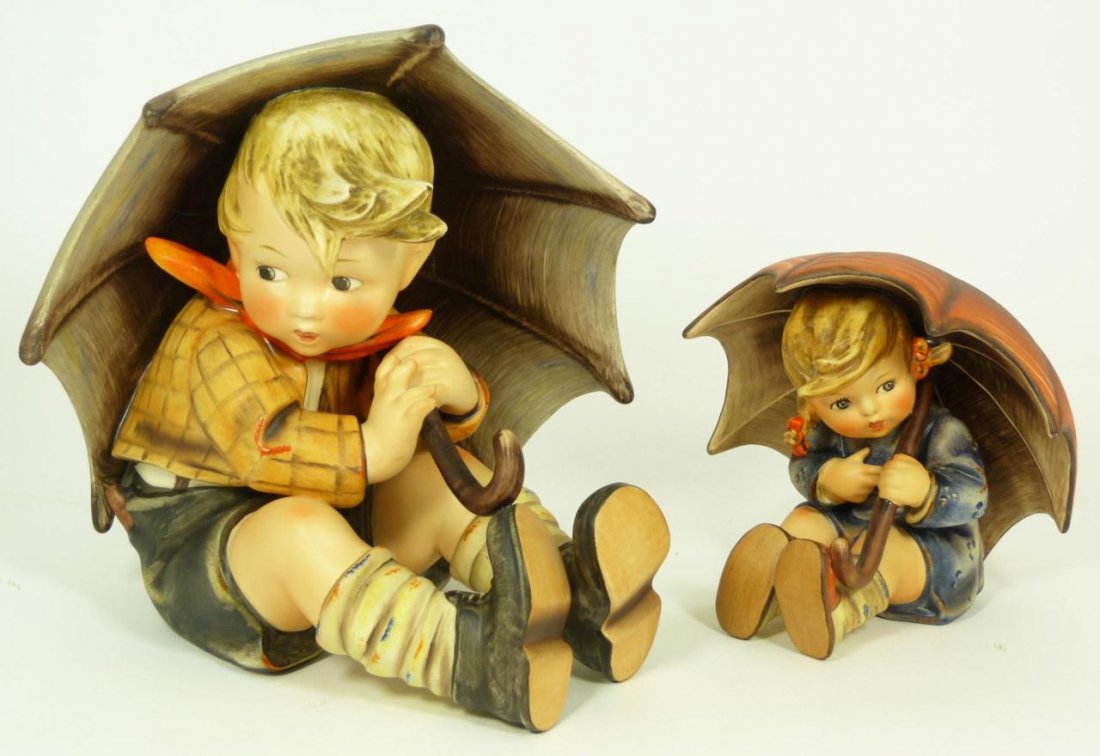 Pr HUMMEL BOY & GIRL WITH UMBRELLA FIGURES: Lot of 2 Goebel Hummel German porcelain figures including 'Umbrella Boy' numbered 152A with the TMK 3 mark and measuring 7 7/8 inch height (20 cm), and 'Umbrella Girl' numbered 152/0 B with the TMK 5