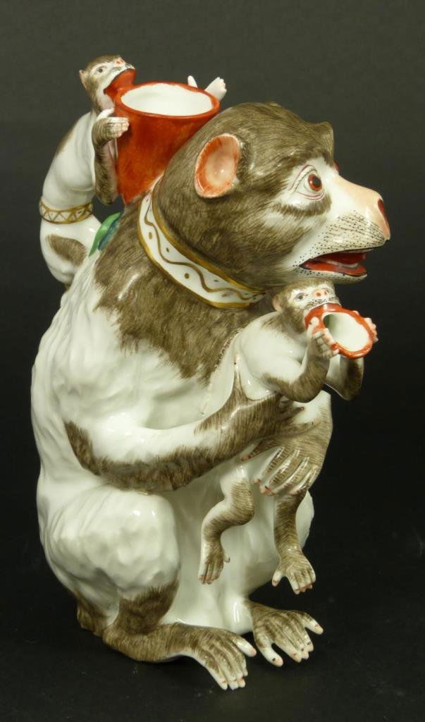 19th C SAMSON FRENCH PORCELAIN MONKEYS PITCHER: Hand painted antique Samson French porcelain figural pitcher depicting a mother monkey with two younger monkeys. Holds blue crossed swords mark to verso. 19th century. Measures 7 1/2" height (19cm). T