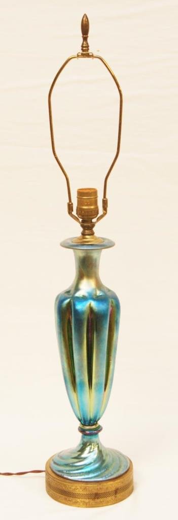 BLUE AURENE IRIDESCENT LAMP TIFFANY OR QUEZAL: 20th century Blue Aurene iridescent art glass table lamp. Perhaps Tiffany, Quezal, Steuben or Loetz. Vase measures 14 1/4" height (36.1cm). Overall height of 29 1/4" height (74.2cm). Total weight of 2