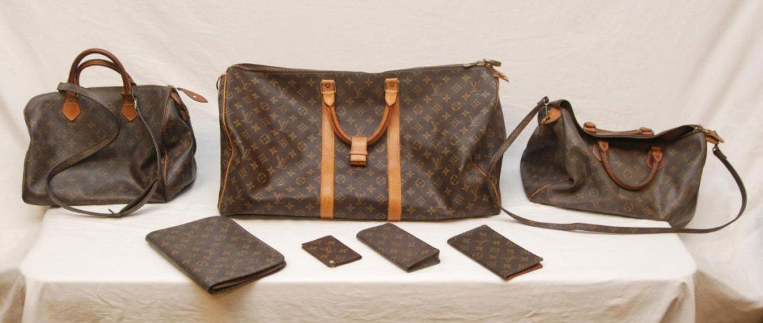 7 LOUIS VUITTON LEATHER HANDBAGS AND ACCESSORIES: Seven piece lot of Louis Vuitton brown leather monogram handbags and accessories. Lot includes glasses case, check book cover, credit card case, address book, 2 purses and duffel bag. Largest piece (d
