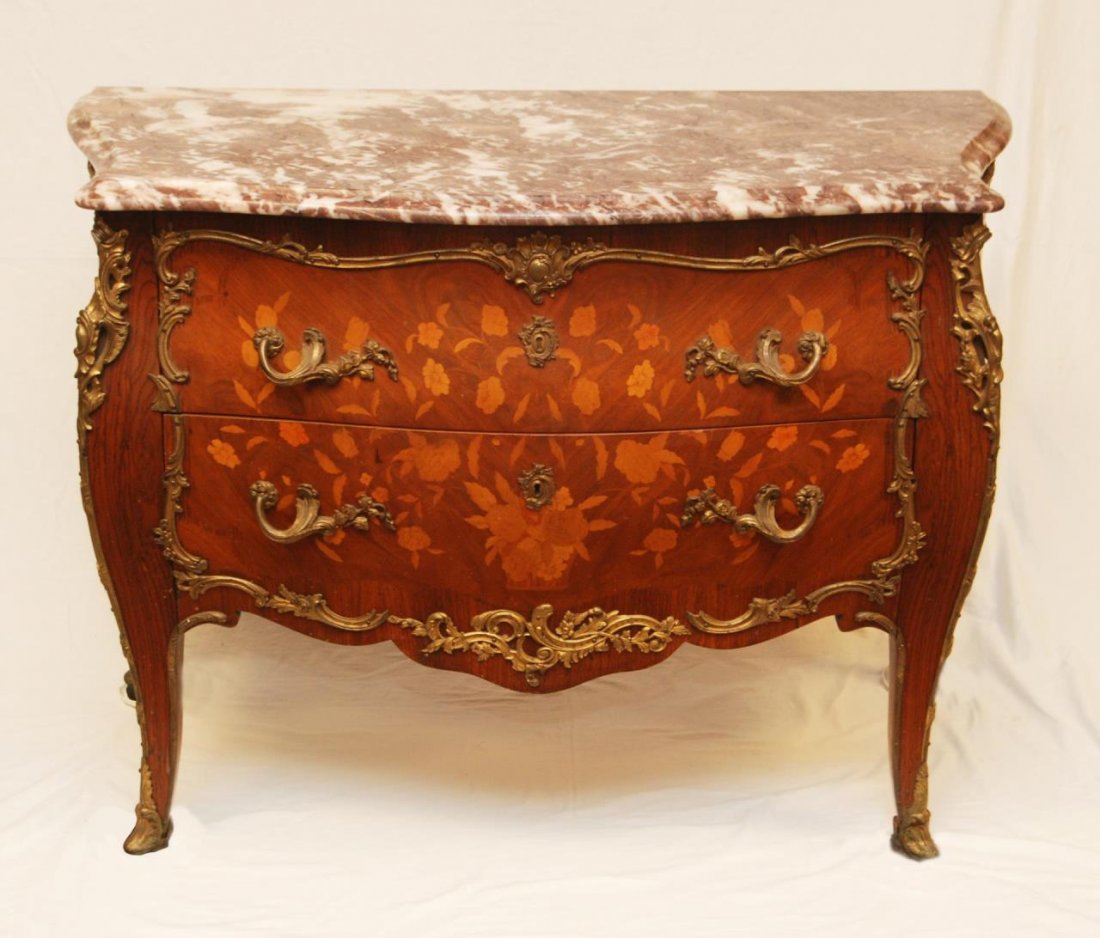 20th C FRENCH STYLE SPANISH MARBLE TOP COMMODE: A 20th century Spanish made marble top commode having a French design with floral inlay and bronze cladding. Measures 34" height x 44" width x 22" depth (86.3cm x 111.7cm x 55.8cm).