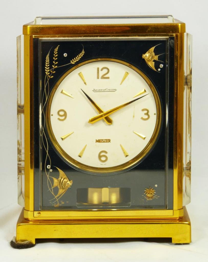 MARINA JAEGER-LECOULTRE BLACK AQUARIUM ATMOS CLOCK: Jaeger-LeCoultre Black Fish Marina "Atmos" clock. Rectangular gilt brass and lucite mantel clock with aquarium panels. Wound by barometric pressure changes. The front panel with aperture to view the p