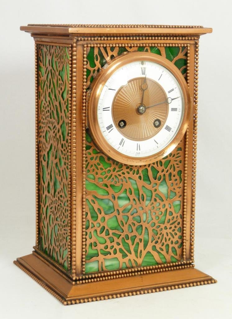 TIFFANY STUDIOS STYLE SLAG CLOCK H&H FRANCE: Old Tiffany Studios style clock having a reticulated grapevine pattern design with green slag glass backing to copper case. Mechanical movement marked 'H & H' and numbered 6459. Also marked 'MADE IN F