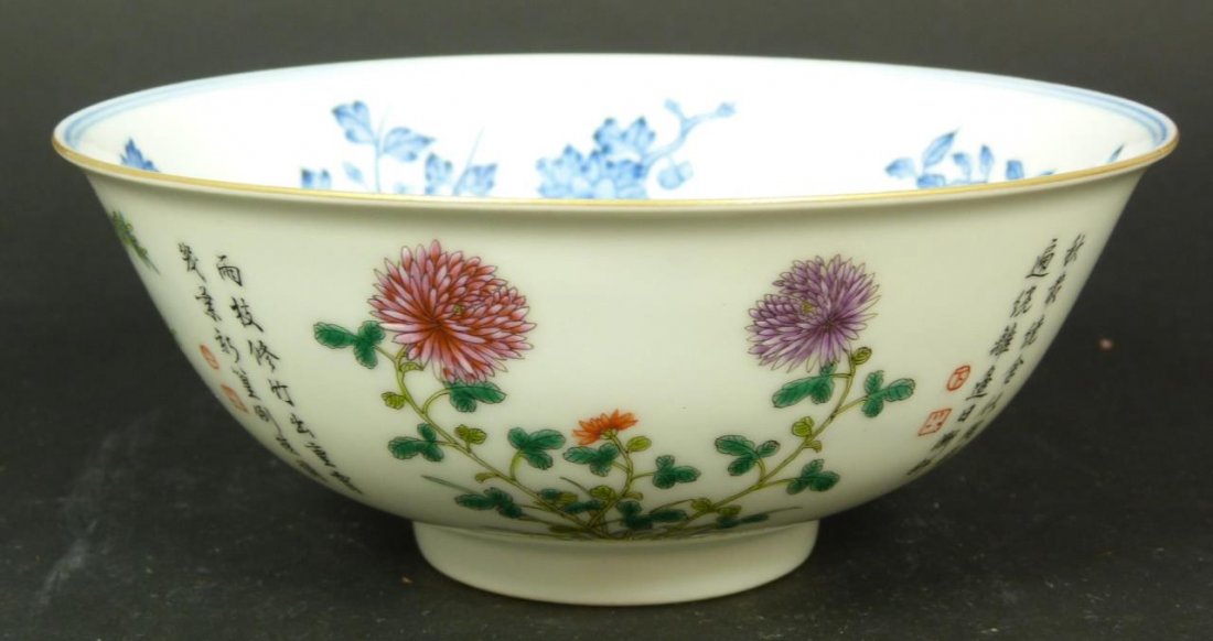 19th C CHINESE HAND PAINTED FAMILLE ROSE BOWL: Antique Chinese Qing Dynasty period Famille Rose bowl depicting blue floral scenes and iron red bats to interior. Exterior depicting multicolor floral scenes with calligraphy poems. Measures 2 1/2" he