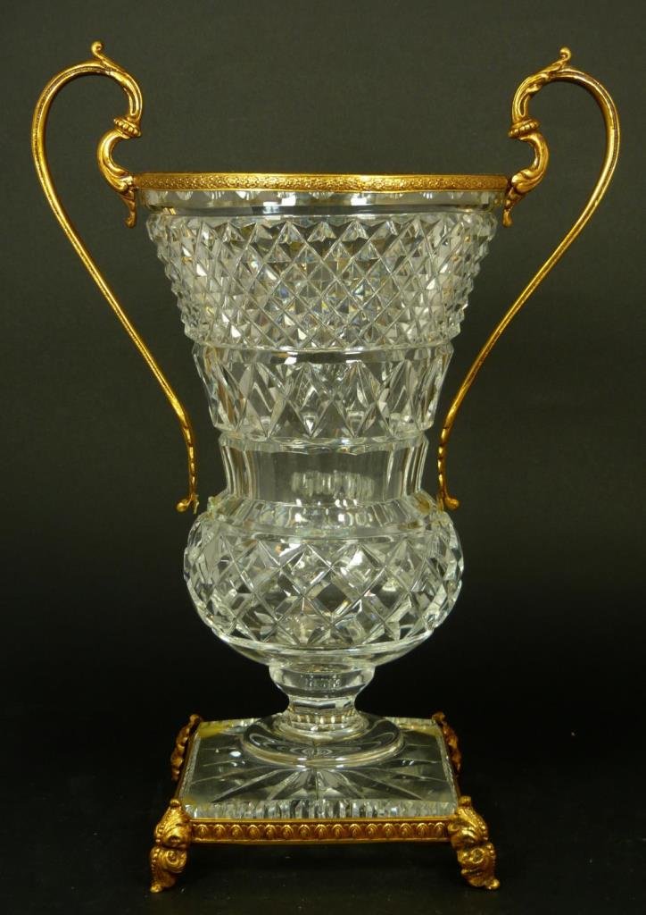 FRENCH CUT CRYSTAL ORMOLU HANDLED VASE: French cut crystal vase having gold ormolu handles and footed base. Measures 12 3/8" height x 9" width (31.4cm x 22.8cm). Total weight of 2326 grams.