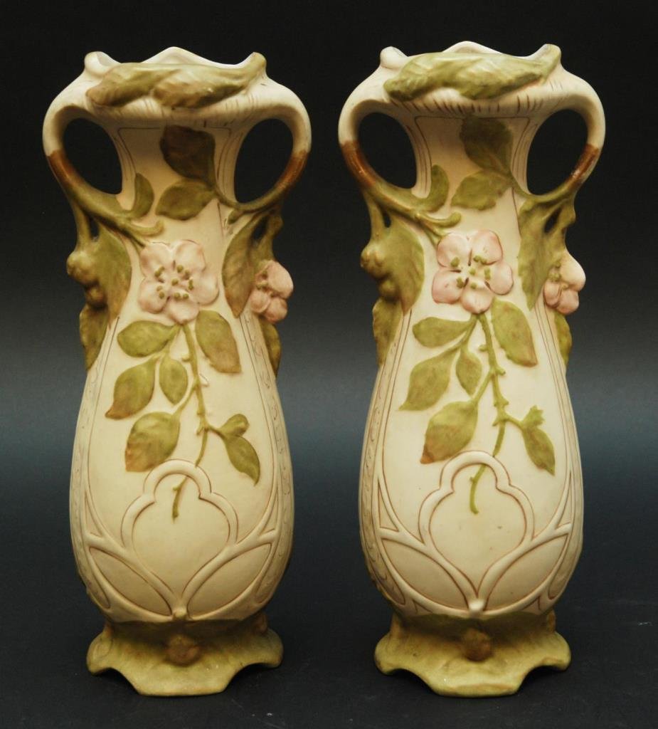 PAIR ROYAL DUX ART NOUVEAU PORCELAIN VASES: Pair of Royal Dux Art Nouveau porcelain vases having raised flower and leaves design throughout. Each with figural vine handles. Each numbered 5505I. Each holds applied pink Royal Dux marks. Circa ear