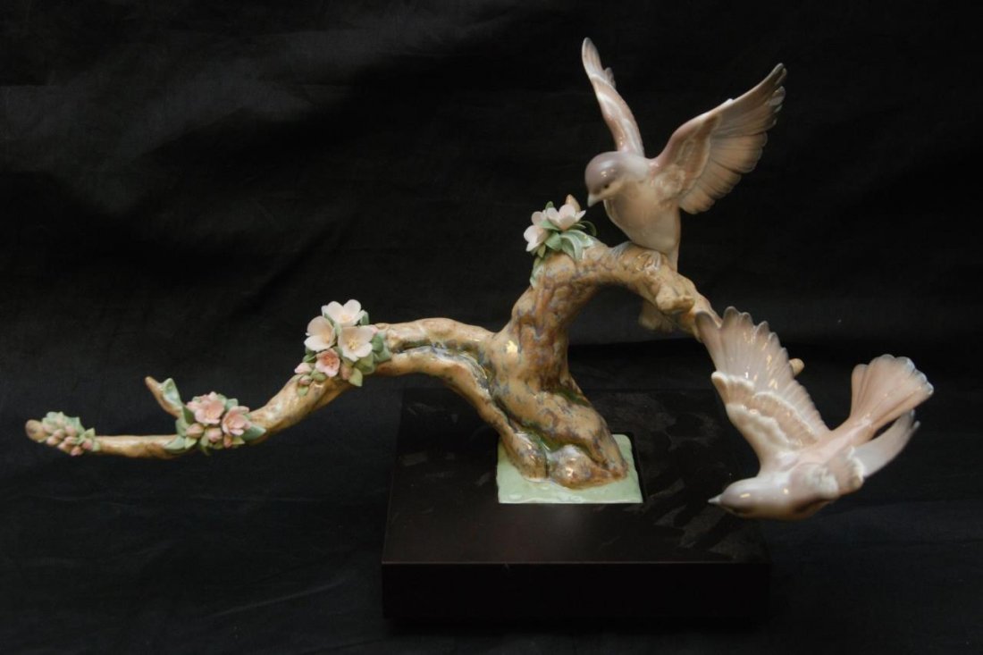 LLADRO SPANISH PORCELAIN SCULPTURE OF BIRDS: A Lladro Spanish porcelain sculpture depicting birds on branch. Includes fitted base. Signed and dated to bottom. Measures 18 1/2" width (46.9cm).