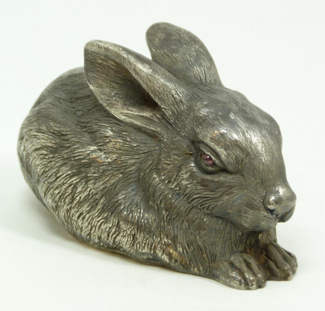 RUSSIAN SILVER JEWELED SEATED RABBIT FIGURE: Russian silver rabbit figure with cabochon cut ruby jewels set in eyes. Has town marks and 88 silver purity marks on bottom. Also holds Julius Rappaport Cyrillic workmaster mark on bottom. Measures 2"