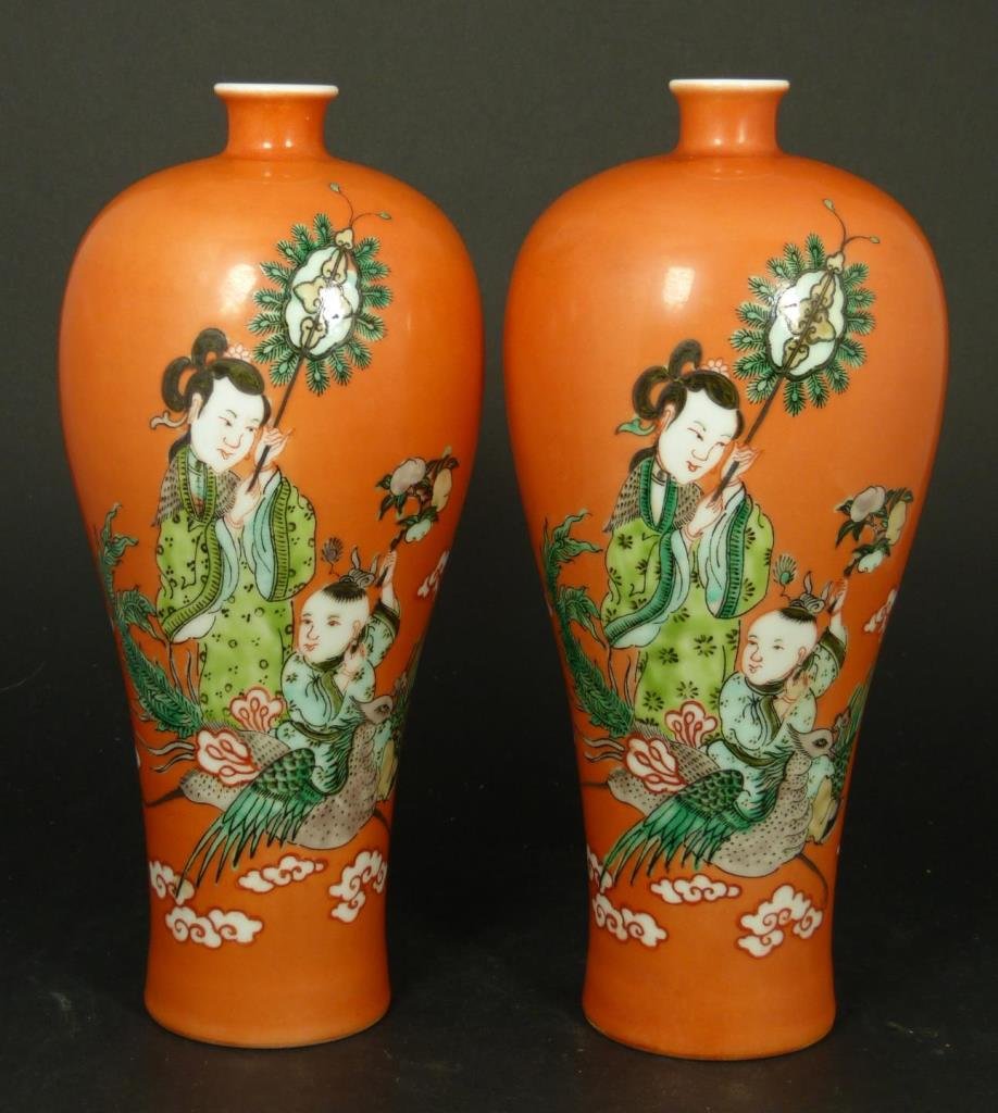PAIR OF 19th CENTURY CHINESE PEACH GROUND VASES: A pair peach ground mei ping form vases depicting maidens with children on phoenix birds. Bottoms hold four character blue calligraphy marks. Circa Qing Dynasty period, 19th century. Each measures app