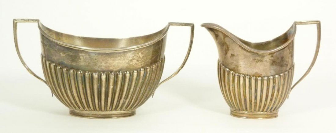 ENGLISH HARRODS SILVER RIBBED SUGAR & CREAMER SET: An early 20th century Harrods / Richard Burbridge English sterling silver sugar and creamer set. Each having a ribbed design to body. Marked 1905 with Sheffield town mark, lion silver purity mark and