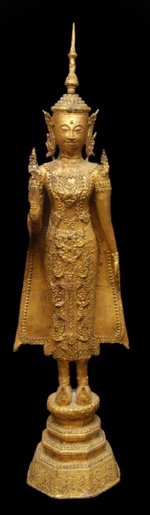 ANTIQUE THAI GILT BRONZE STANDING BUDDHA SCULPTURE: A large and antique Thai gilded bronze standing Buddha sculpture. He is depicted in a standing position on tiered base. 18th/19th century. Measures 40 1/4" height (102.2cm). Provenance: From the Estat