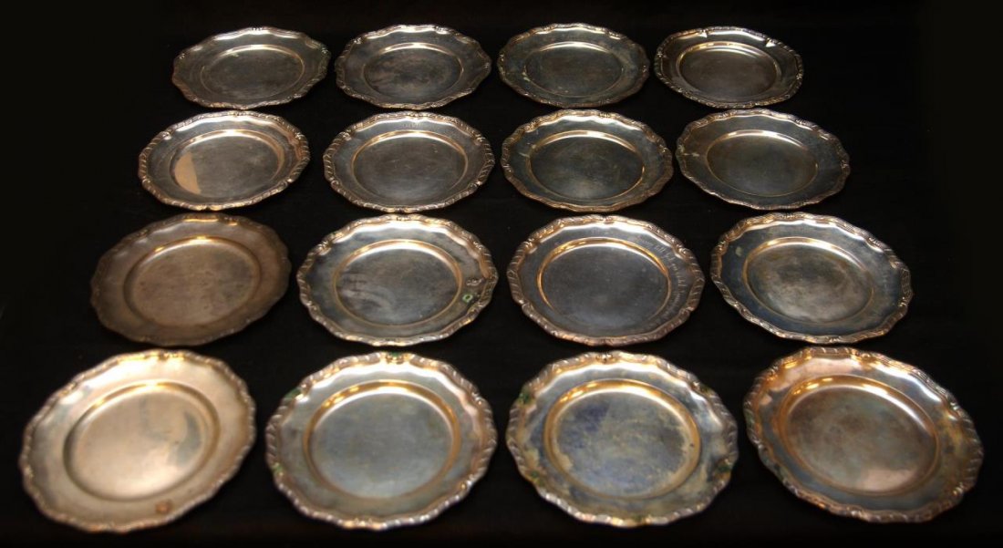 16 EARLY 20th C SWEDISH SILVER TROPHY PLATES: A collection of sixteen engraved Swedish silver dessert or bread and butter size trophy plates. Each plate from various makers, but have the same stylized bundled line design with cross ribbons to sca
