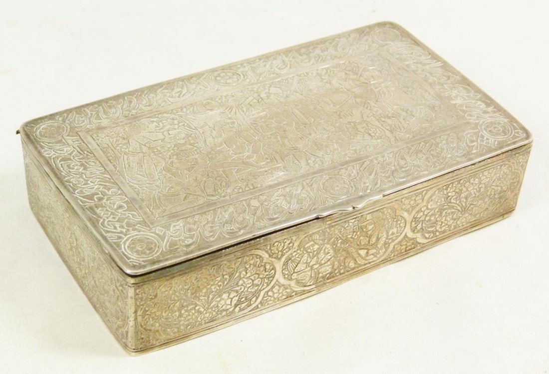 TURKISH SILVER RECTANGULAR HAND CHASED COVERED BOX: Turkish silver hand chased rectangular covered box. Hallmarks inside of lid. Box measures approx. 4 1/2" (10.5 cm) length and 2 1/2" (5.5 cm) depth and 1" (2.5 cm) height. 5.78ozt. Provenance: From th