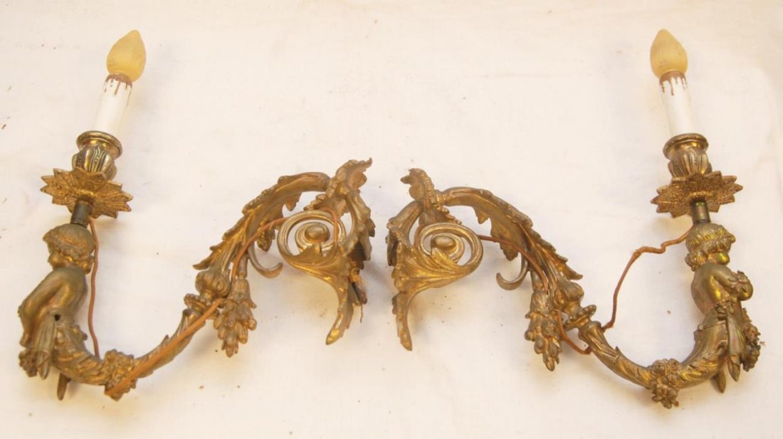 PAIR OF LOUIS XVI STYLE FIGURAL SINGLE WALL SCONCE: Pair of Louis XVI style figural single dore bronze wall sconces. Measure approx. 14" (35.5 cm) overall height and 11" (28 cm) depth. Provenance: From the Estate of Count and Countess Claes-Eric de Lew