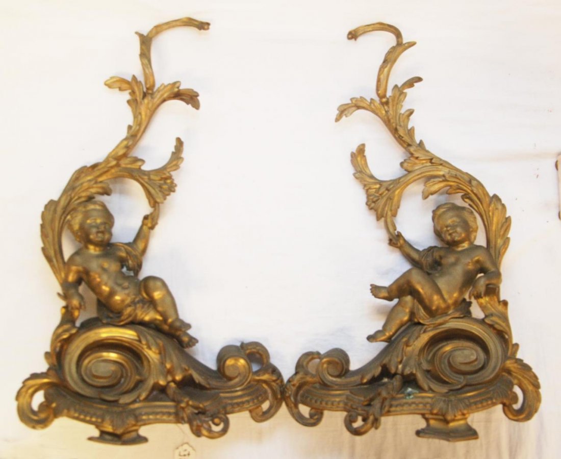 PAIR OF FRENCH FIGURAL BRONZE ANDIRONS: Pair of French bronze figural andirons with cherubs on scroll like bases. Measures 24" (61 cm) approx. height. Provenance: From the Estate of Count and Countess Claes-Eric de Lewenhaupt of Sweden.