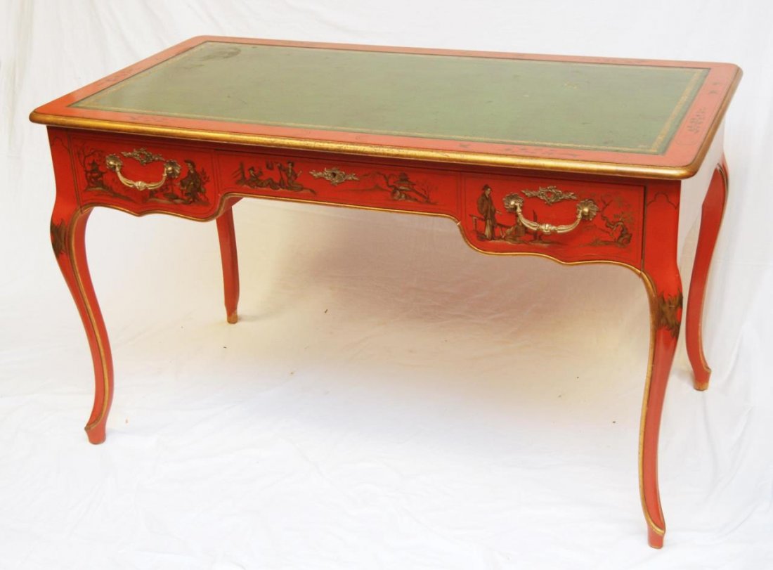 BAKER RED LACQUER CHINOISERIE LEATHER TOP DESK: An old hand painted and bronze mounted red lacquer Baker Chinoiserie green leather top desk. Has three drawers with bronze mounted handles. Late 19th to early 20th century. Has oval metal Baker plaque